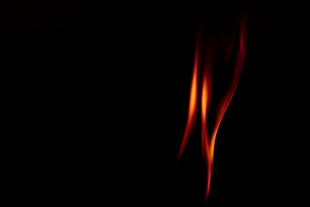 An image of a red flame An image of a flame with a sleek design representing Legacy Risk Advisors individual services .
