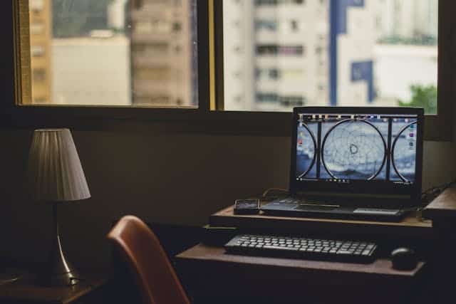 Legacy Risk Advisors Office Setup Office workspace with computer and city view for risk management.