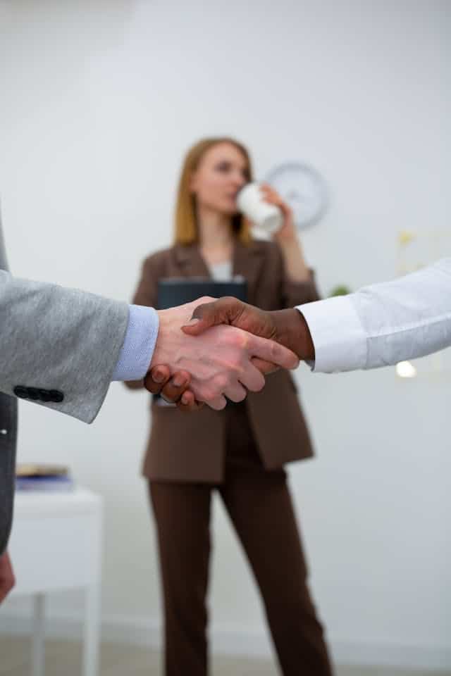 Legacy Risk Advisors Handshake Business handshake symbolizing trust and partnership in insurance services.